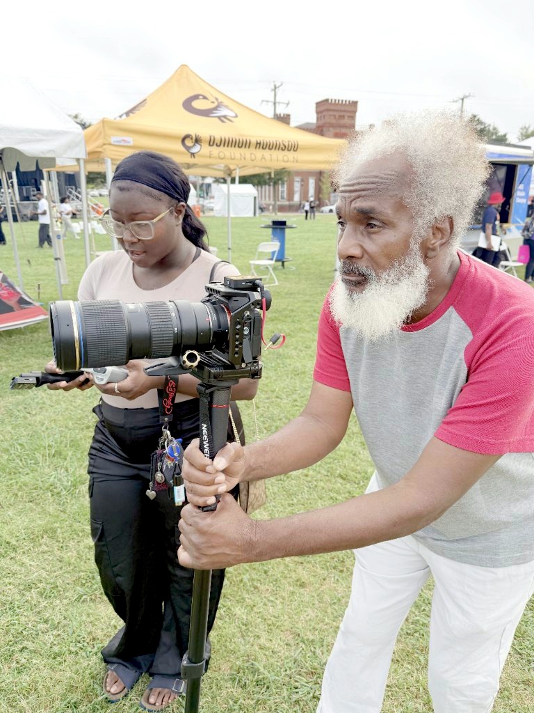 VUU student Destiny Douglass controlling the drone while King Shepard works a camera at Abner Clay Park