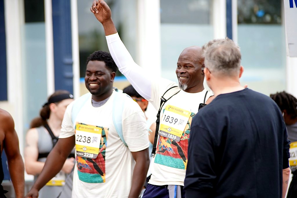 Djimon Hounsou raising a fist and smiling after Run Richmond 16.19